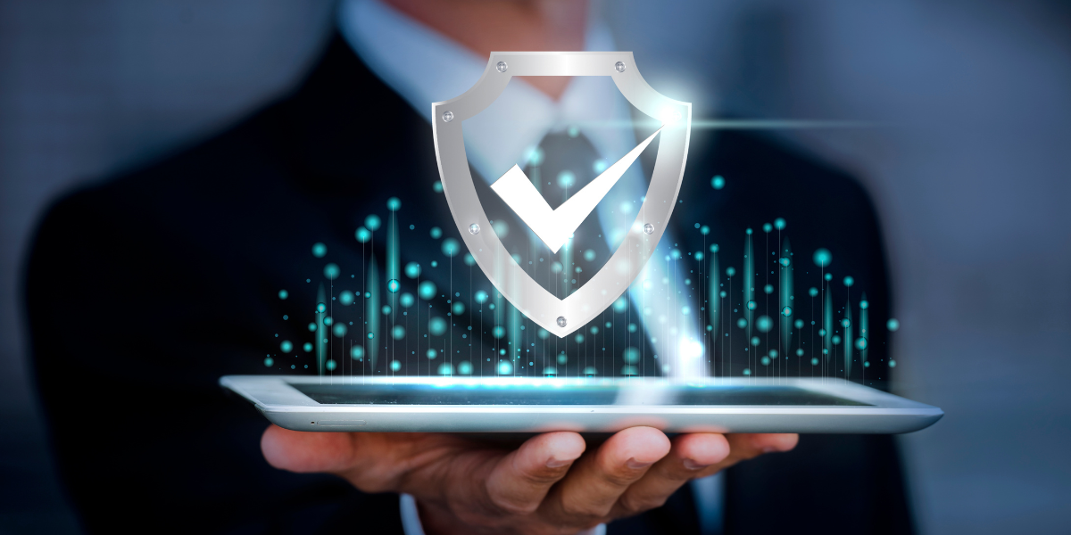 202405_III_ZeroTrustSecuirtyModels man holding a tablet implementing a zero trust security model