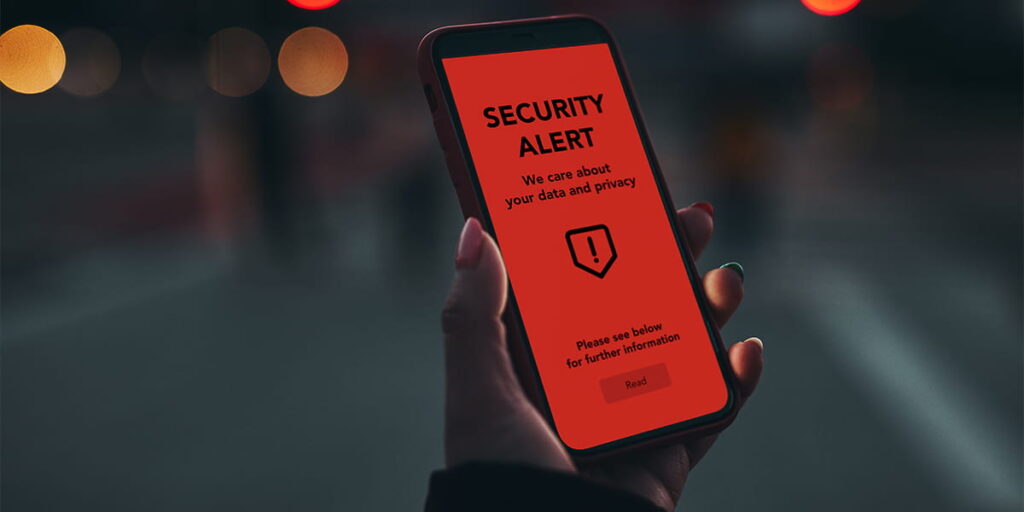 a mobile device with a red screen and security alert message