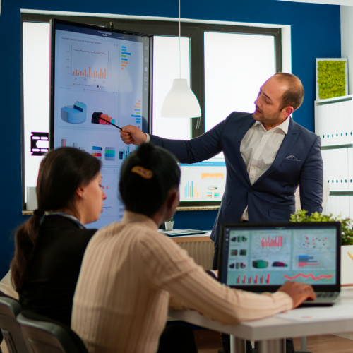 Business partner presenting company strategy to diverse team